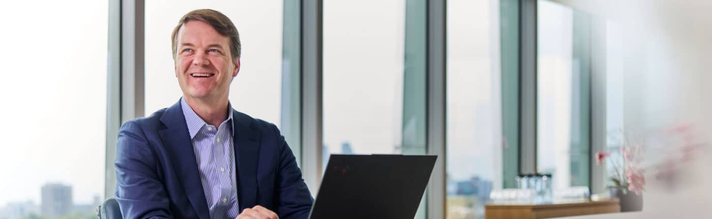 photo of Jeff Paduch sitting at a desk with a laptop