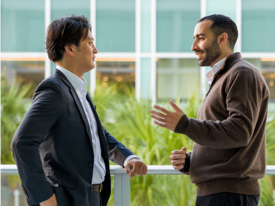 Colleagues chatting on a balcony